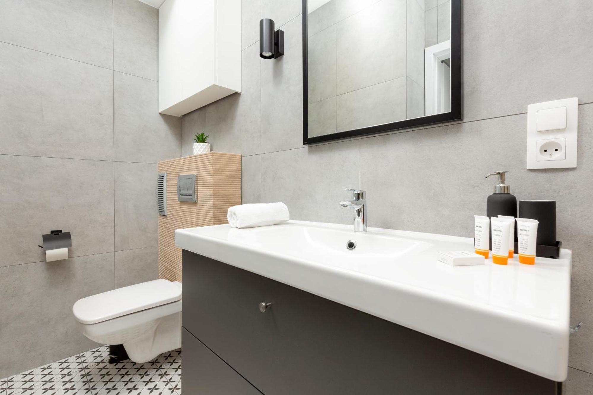Central Apartment Emilii Plater By Noclegi Renters Warsawa Bagian luar foto
